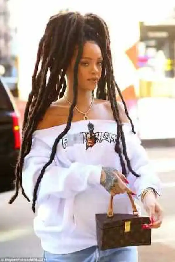 Rihanna Steps Out With Her Huge Dreadlocks & Pair Of Ripped Denim In New York (Photos)